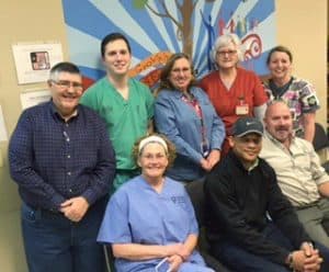 Volunteers at this year's Soles4Souls included Paul Wilkerson (top row from left), Kevin Goodson, M.D., Ruth Thomas, M.D., Debbie Bryant, L.P.N., and Beth Williams, as well as Karen Seale, M.D. (bottom row from left), David King and Vince Mann.