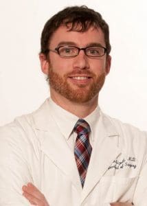 Jason Mizell, M.D., associate professor of surgery in the Division of Colorectal Surgery in the UAMS College of Medicine., says an earlier colonoscopy likely would have prevented Beverly Seaberg's colon cancer.