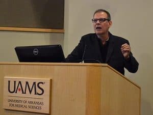 Arturo Casadevall, M.D., Ph.D., tells a UAMS crowd that the scientific enterprise is under attack from external and internal forces.