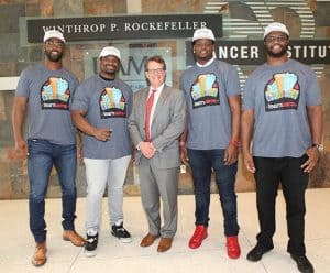 Cancer Institute Director Peter Emanuel, M.D., with (from left) Michael Johnson of the Cincinnati Bengals, Clinton McDonald of the Tampa Bay Buccaneers, Demetrius Harris of the Kansas City Chiefs and Lazarius Levingston of the BC Lions.