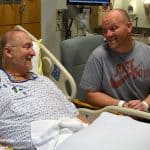 James Johnson Jr. (left) laughs with his brother, Jeff, two days after the brothers underwent kidney transplant surgeries at UAMS. Jeff donated a kidney to James.