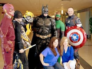 Superheroes pose in the UAMS Medical Center during the 5th Annual NICU Reunion. 