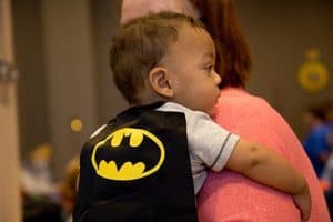 Braylen, 10 months, wears a batman cape during the superhero-themed event. He was born at 27 weeks and spent 155 days in the hospital. 