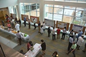 Guests gather to discuss UAMS research projects at the Showcase on Medical Discoveries.