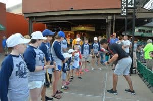 ROC Stars get a pep talk prior to the Arkansas Travelers baseball game.