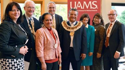Sheldon Riklon, M.D., (center) was invested into the Peter O. Kohler, M.D., Endowed Distinguished Professorship in Health Disparities. He is shown with Pearl McElfish, Ph.D., Peter Kohler, M.D., Nia Aitaoto, Ph.D., Chancellor Dan Rahn, M.D., Provost Stephanie Gardner, Pharm.D., Ed.D., Lynda Riklon and Pope Moseley, M.D.