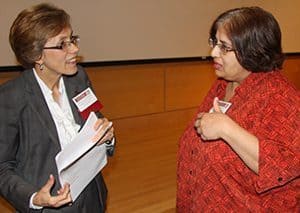 Penny Kris-Etherton, Ph.D., R.D., left, talks with Gohar Azhar, M.D., after Etherton spoke at the Geriatrics Update. Azhar is co-director of the Cardiovascular Aging Program in the UAMS College of Medicine and a physician scientist at the Reynolds Institute on Aging.