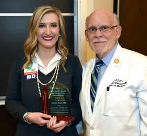 Megan R. Davis, M.D., left, receives the 2016 student Hackler ethics award from James D. Marsh, M.D.