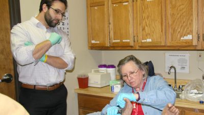 Doctor examines foot