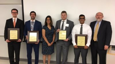 Group shot with plaques