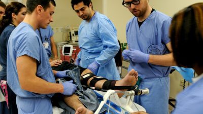 ER staff work on patient
