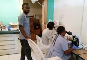 Workers from the clinic in Jubilee Blanc, Haiti, work in the laboratory that Lindsay Gilbert and two other laboratorians set up during their week-long medical mission trip.