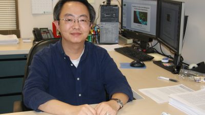 Scientist seated at desk