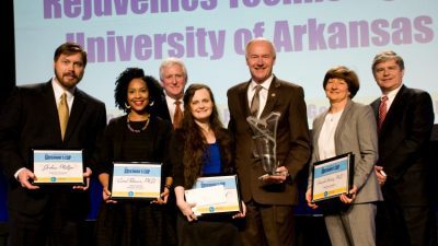 Winners of the Governor’s Cup business plan competition are (l-r): team members Joshua Phillips, Tiffany Jarrett and Amanda Stolarz. They are joined by (back left) Rush Deacon, CEO, Arkansas Capital Corporation; Gov. Asa Hutchinson, Carol Reeves, team adviser, and Kevin Burns, chairman of the board, Arkansas Capital Corporation.