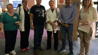 Despite a fire alarm evacuation, the TRI study team kept testing on schedule in UAMS Parking 3 for research participant Homer Paul (center). Team members are (l-r) Cynthia Witkowski, Angela Moore, Ashley Sides, Dr. Rohit Dhall and Shannon Doerhoff.