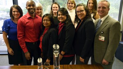 Group shot with award