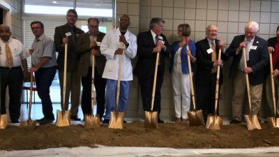 With golden shovels at the ready are (from left to right) P. Vasudevan, M.D., Dennis Delk, Tim Hill, J.T. Thacker, Thomas Bailey, M.D., Mark Kenneday, Becky Hall, Ed.D., Victor Juengel, Phillips County Judge Clark Hall, and state Rep. Chris Richey.