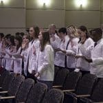 The Physician Assistant Class of 2019 recites the PA Professional Oath after the students received their white coats during a May 26 ceremony.