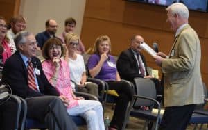 Chancellor laughing at jokes