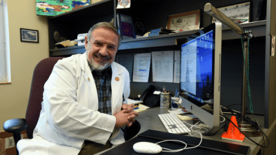 Dr. Garcia-Rill seated at desk