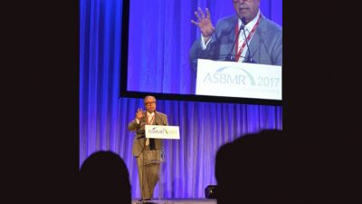 Manolagas speaking at podium