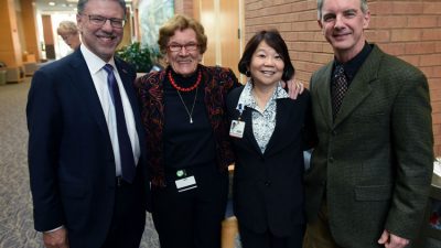 Harry Johns, left, with Jeanne Wei, M.D., Ph.D., Sue Griffin, Ph.D., and Steve Barger, Ph.D. at a reception prior to the STOP Alzheimer's Forum on Oct. 30.
