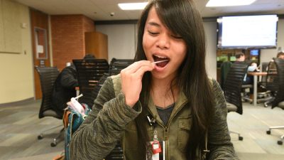Student swabs mouth