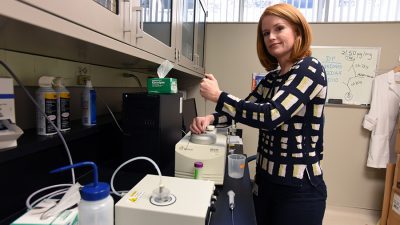 Misty Stevens demonstrates one of the lab procedures InterveXion uses in the development of the monoclonal antibody it is studying for possible future use in the treatment of methamphetamine addiction.