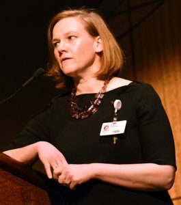 Erika Petersen, M.D., speaks at a podium