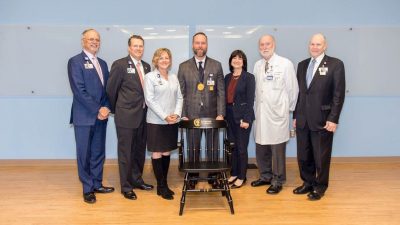 Brian Reemtsen, M.D., (center) was invested April 4 in the Arkansas Log a Load for Kids Endowed Chair in Pediatric Cardiovascular Surgery. With him (from left) are Jay Deshpande, M.D.; Phillip Jett; Arkansas Children’s President and CEO Marcy Doderer; UAMS Interim Chancellor Stephanie Gardner; Frederick Bentley, M.D.; and Christopher T. Westfall, M.D.