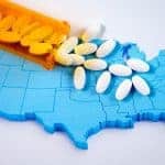 Pills spilling out over a map of the U.S.