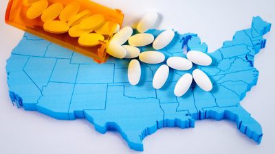Pills spilling out over a map of the U.S.