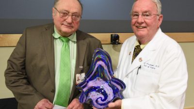 Two doctors with glass bowl