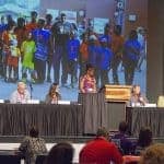A panel of AR SAVES stroke survivors discuss their experiences during the Telestroke Conference in May in Hot Springs as a slide show behind them illustrates their stories and the history of the program.