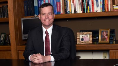 Dr. Patterson at desk
