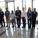 Chancellor Cam Patterson (center) and Billy Thomas, M.D., (right) vice chancellor for diversity, pose for a photo with the new UAMS Project SEARCH interns.