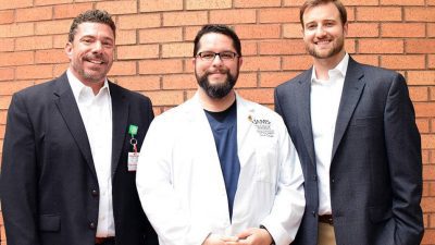 College of Pharmacy students Zach Smith (center) and Matt Garner (right) played major roles in the creation of dozens of YouTube videos containing pharmacist-level drug counseling for patients. Seth Heldenbrand, Pharm.D., (left) the college’s associate dean of experiential education, conceived and oversaw the project.