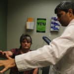Kimberly Zimmer visits neurologist Rohit Dhall, M.D., to check the results of her deep brain stimulation surgery.