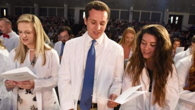 After receiving their white coats, members of the College of Pharmacy's Class of 2022 recite the Student Pledge of Professionalism.