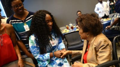 First-year medical students Brittany Demmings and Tia'Asia James meet Edith Irby Jones, M.D. (at right) after receiving scholarships created in her name.