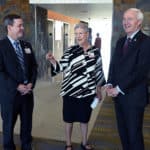 Winthrop P. Rockefeller Cancer Institute Interim Director Laura Hutchins, M.D., (center) leads Arkansas Gov. Asa Hutchinson (right) and UAMS Chancellor Cam Patterson, M.D., MBA, on a tour of the Cancer Institute.