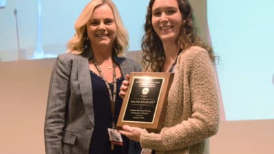 Lindsay Gilbert, M.Ed., (right) an assistant professor in the Department of Laboratory Sciences, receives the Excellence in Teaching Award from Tina Maddox, Ph.D., associate dean for academic affairs.