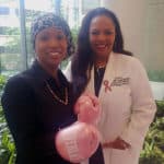 Abby Ellington (left) dons her pink boxing gloves for her ongoing fight against breast cancer. She is pictured with her surgeon, Ronda Henry-Tillman, M.D.