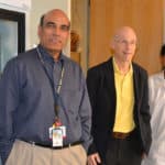 Srinivas Ayyadevara, left, Robert Shmookler Reis and research associate Ramani Alla stop for a photo in their UAMS Donald W. Reynolds Institute lab.