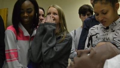 Students from Little Rock Central High School are surprised when a mannequin at the UAMS Simulation Center provides verbal feedback during their visit for Physiology Understanding ("PhUn") Day.
