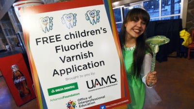 The Delta Dental Tooth Fairy encourages Boo at the Zoo participants to get their free fluoride varnish application.