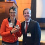 UAMS Chancellor Cam Patterson, M.D., MBA, and Mary Cantrell stop for a photo at the Employee Services Awards ceremony.