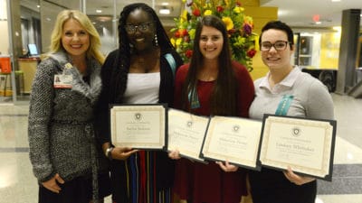 Catherine M. Smith, M.Ed., (left) director of the Cytotechnology program, celebrates with Taylor Jackson, Makenzie Pierce and Lindsey Whittaker on their scholarship awards.