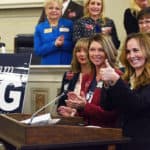 State Sen. Missy Irvin of Mountain View gives a thumbs up after announcing legislative support for the UAMS Cancer Institute’s quest to achieve NCI Designation. She is joined by fellow members of the Republican Women’s Legislative Caucus, including co-lead sponsor Rep. Michelle Gray (in red jacket).