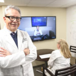 Curtis Lowery, M.D., left, pauses during a live video conference. Lowery founded the AR SAVES program, which has been named one of three national finalists for the Hearst Health Prize.